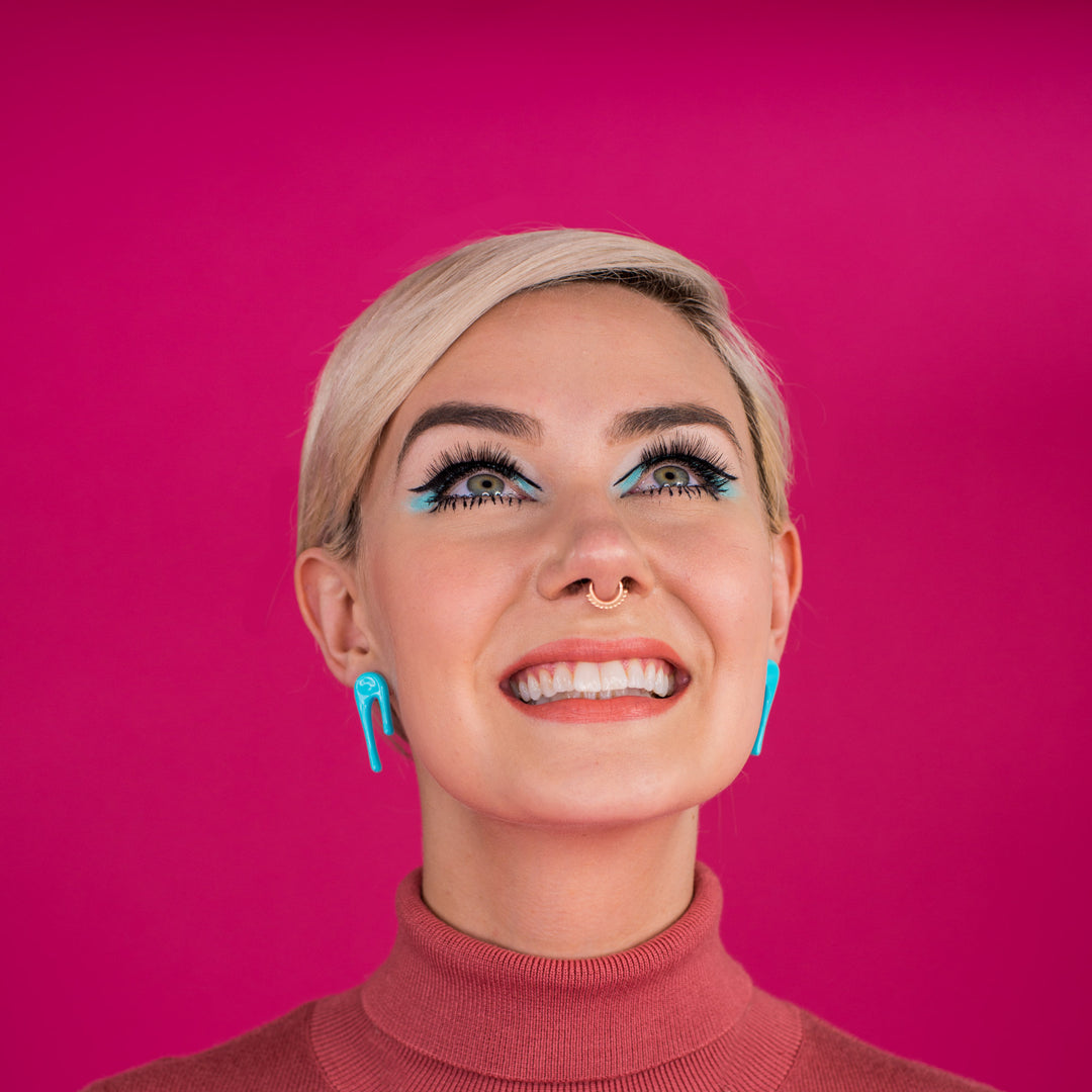 droplet blue stud earrings on model