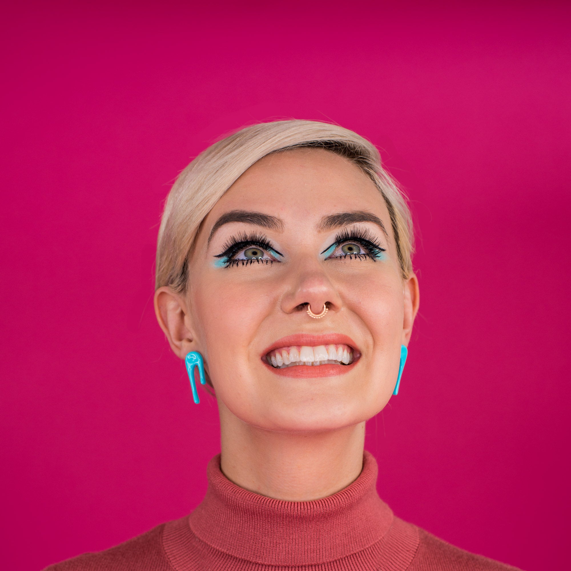 droplet blue stud earrings on model