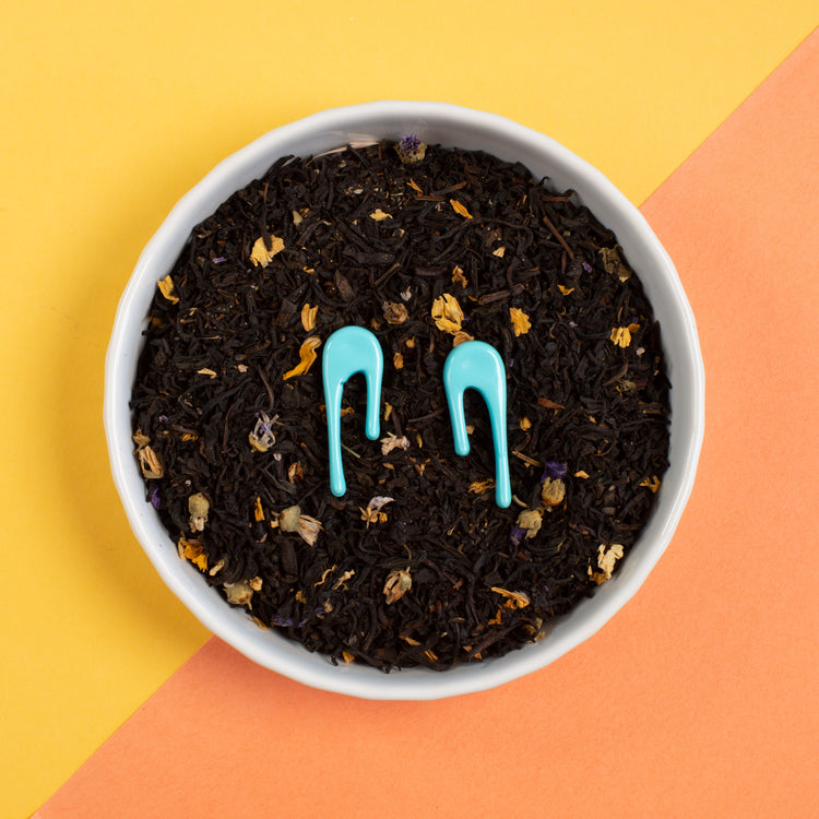droplet blue stud earrings in bowl