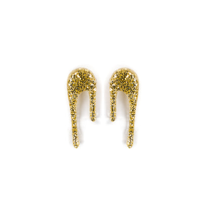glittery gold stud earrings over white