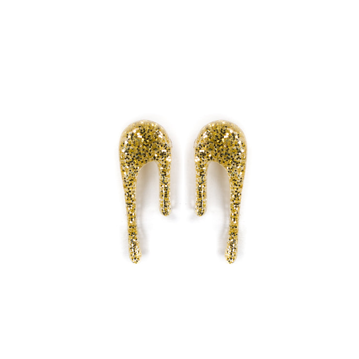 glittery gold stud earrings over white