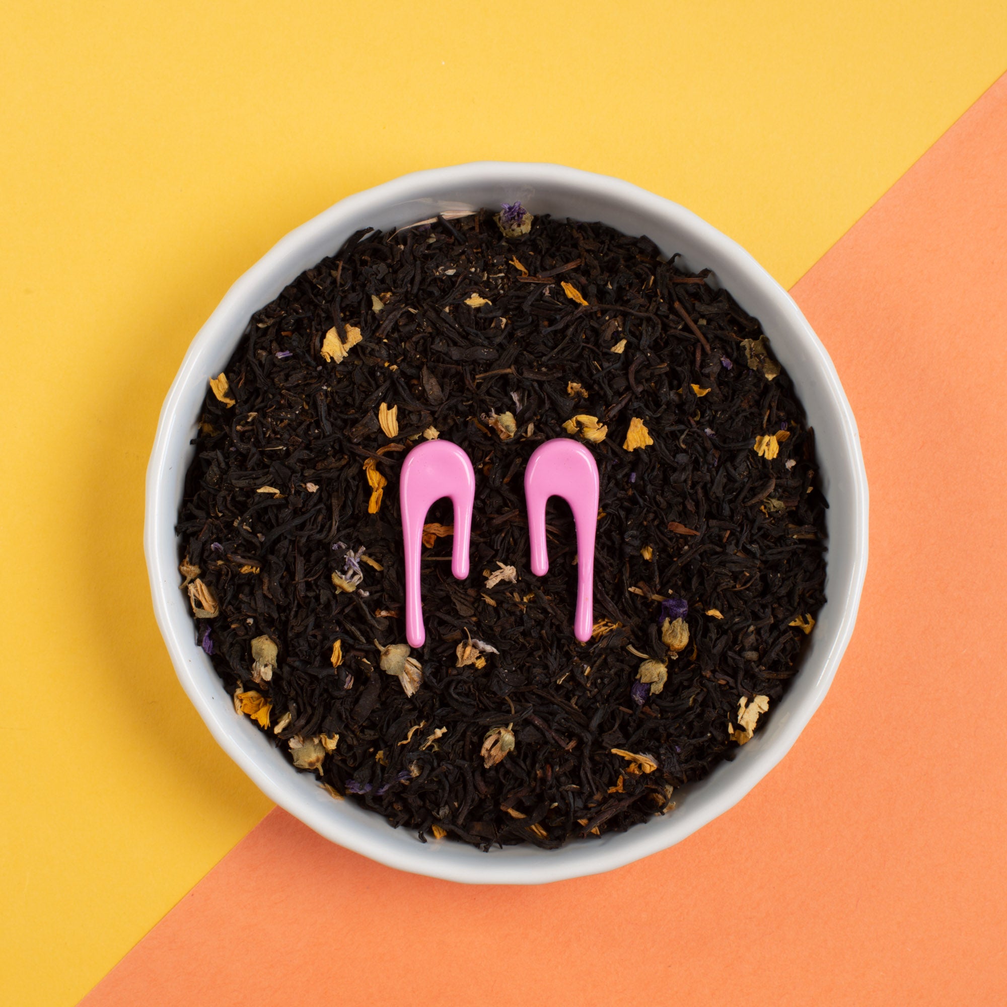 droplet pink stud earrings in bowl