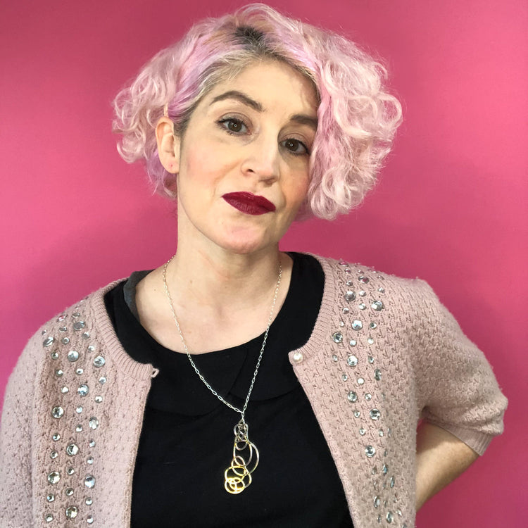 Iridescent pendant necklace on model