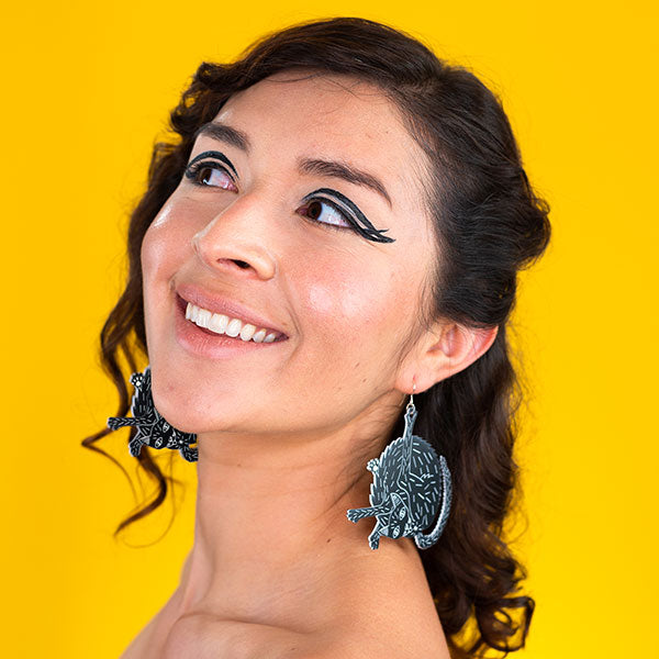 large black cat earrings on model
