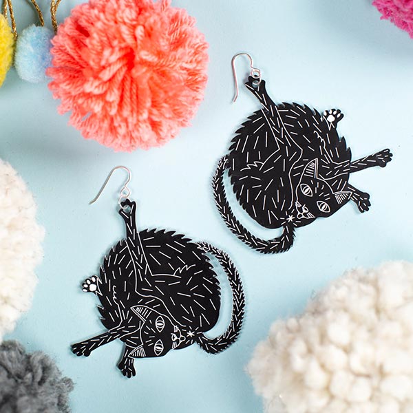large black cat earrings styled