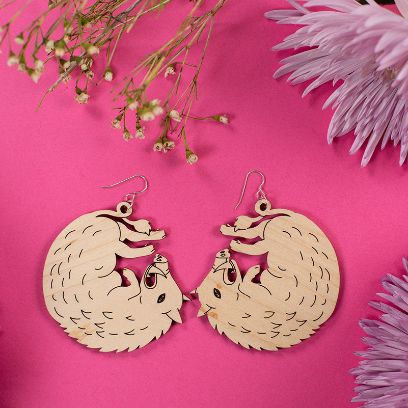 large wood boar earrings styled with flowers