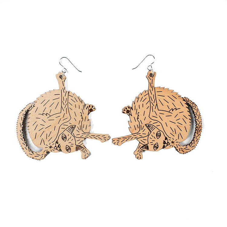 large wood cat earrings over white background