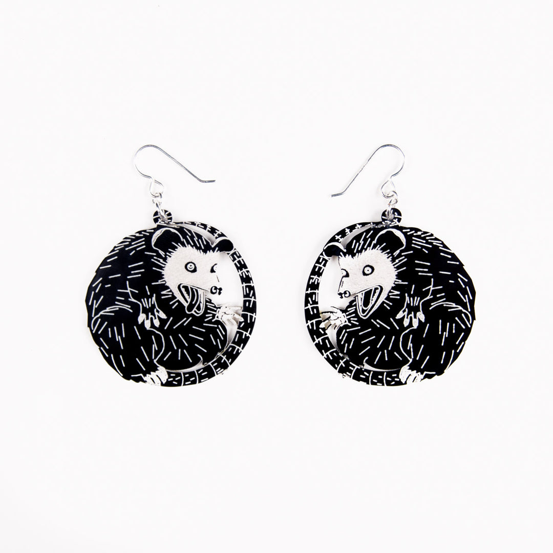 small possum earrings on white earrings