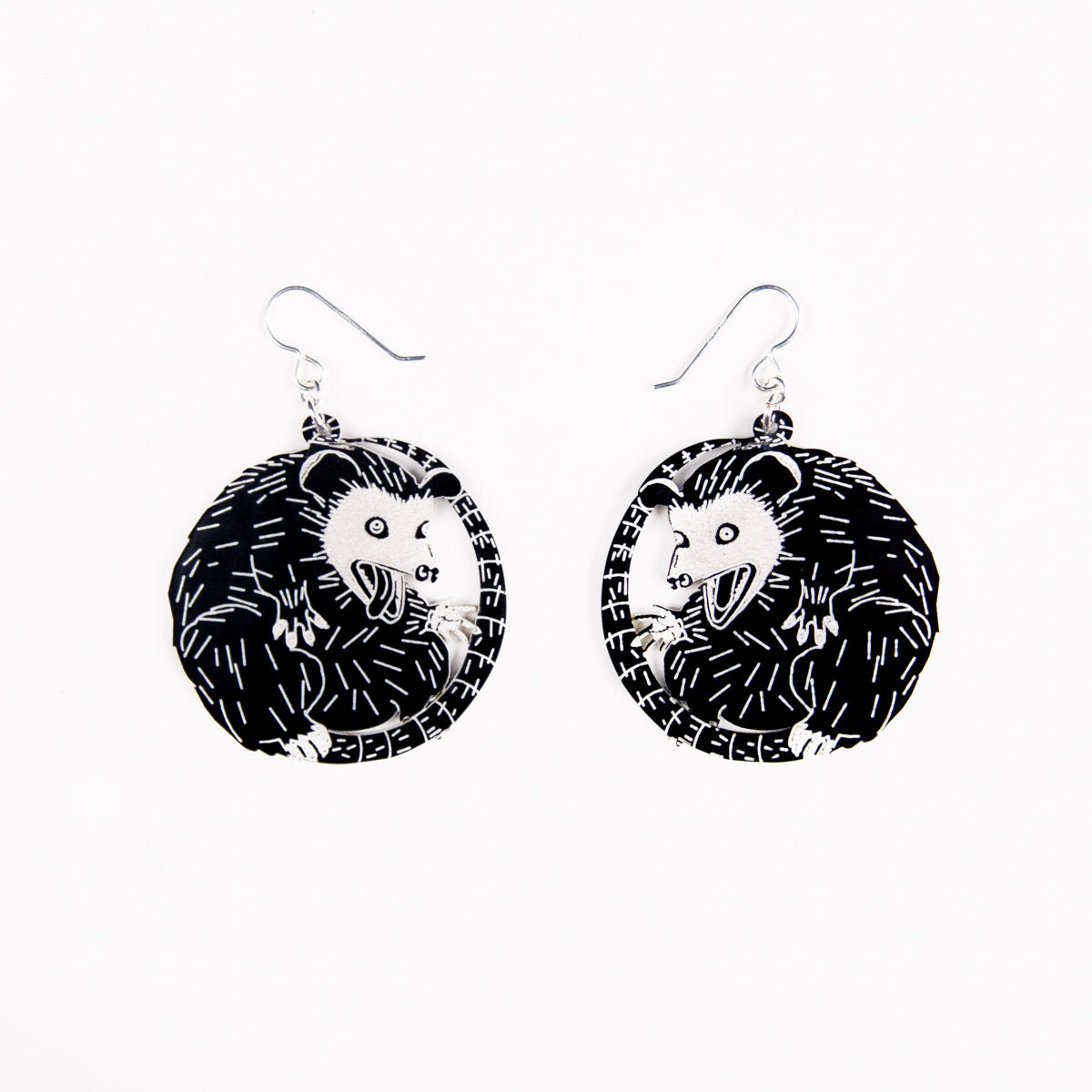 small possum earrings on white earrings