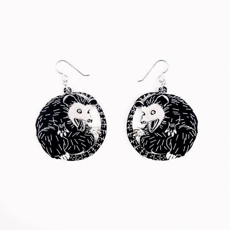 small possum earrings on white earrings