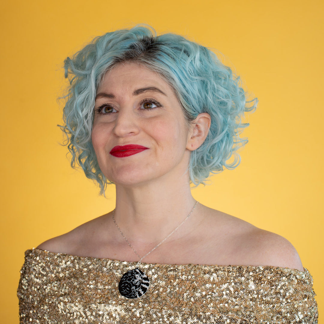 raccoon necklace shown on model