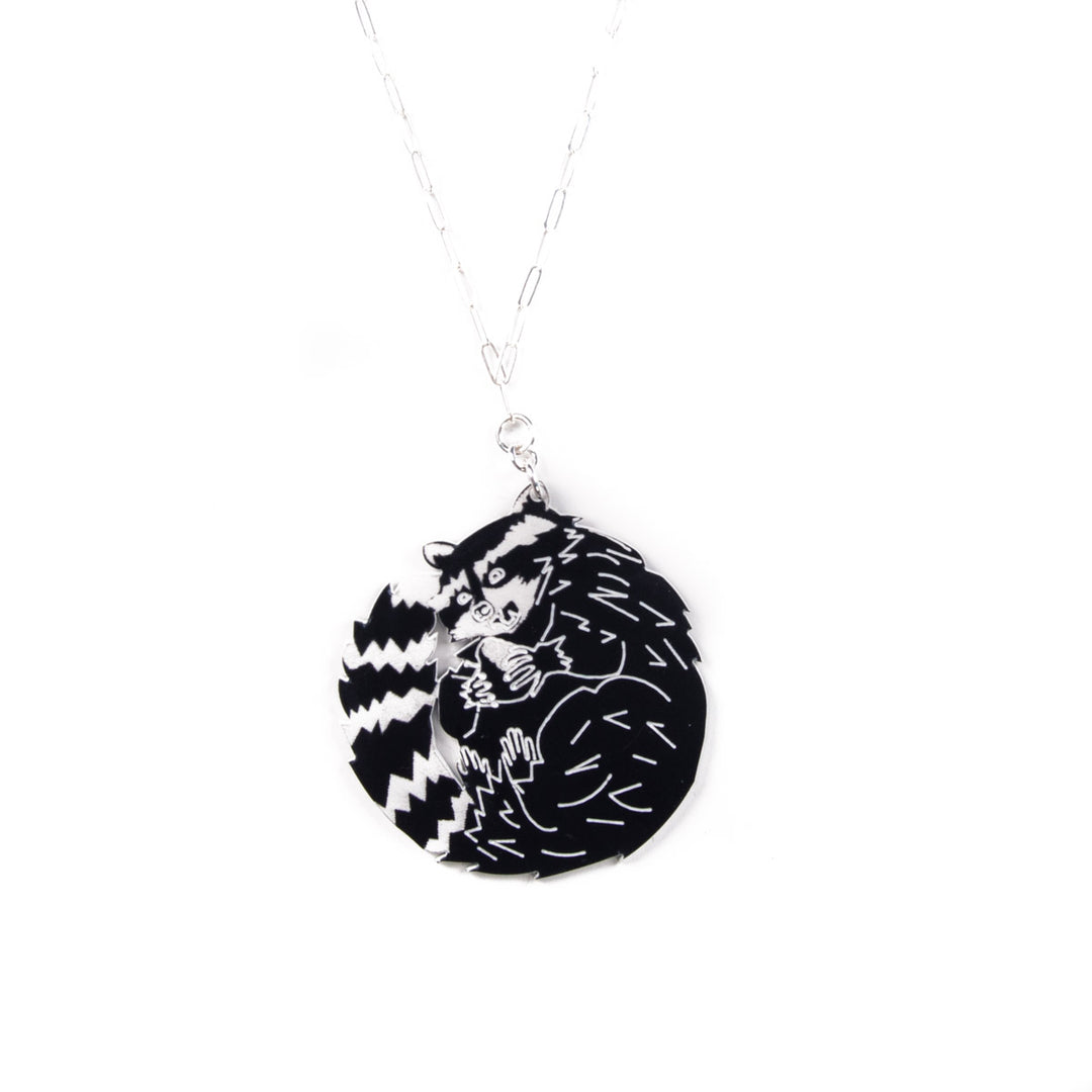 raccoon necklace on white background