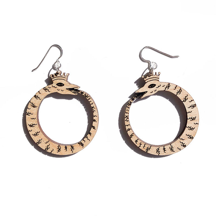 small wood ouroboros earrings on white background