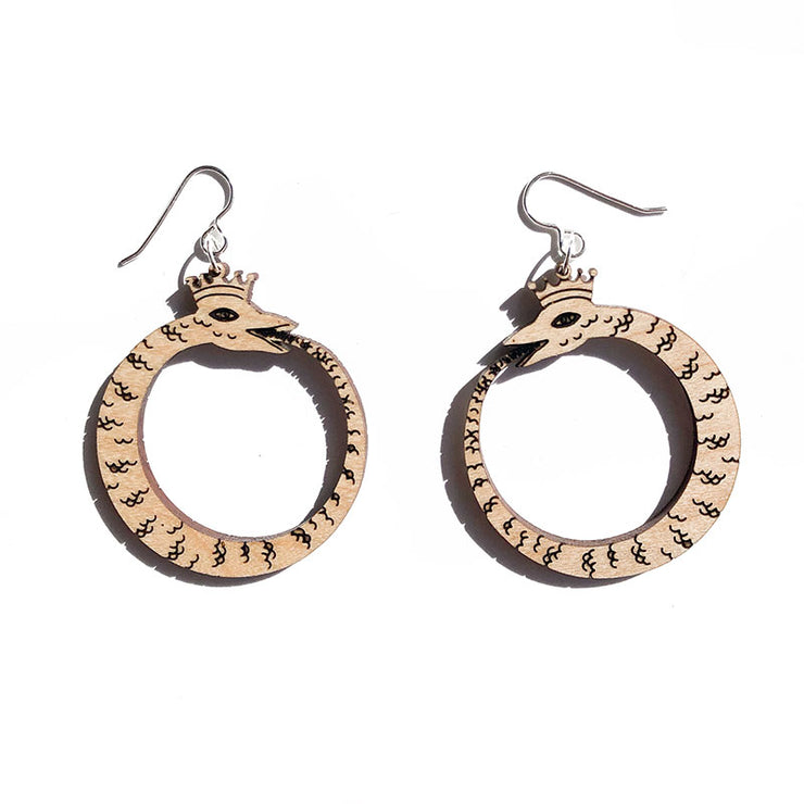 small wood ouroboros earrings on white background