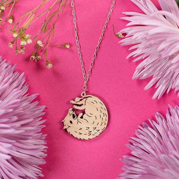 wood boar necklace styled with flowers
