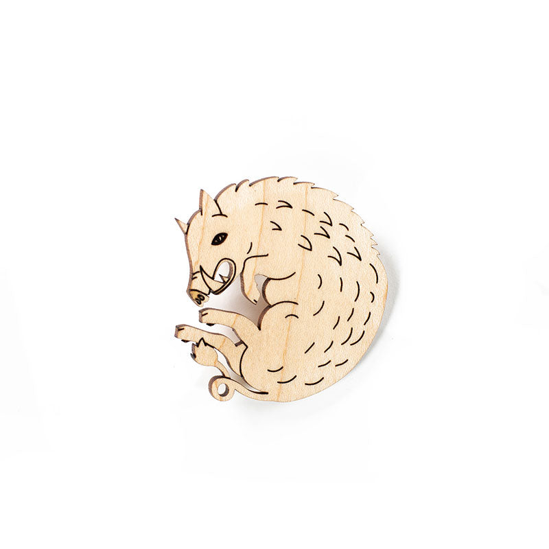 wood boar pin over white background