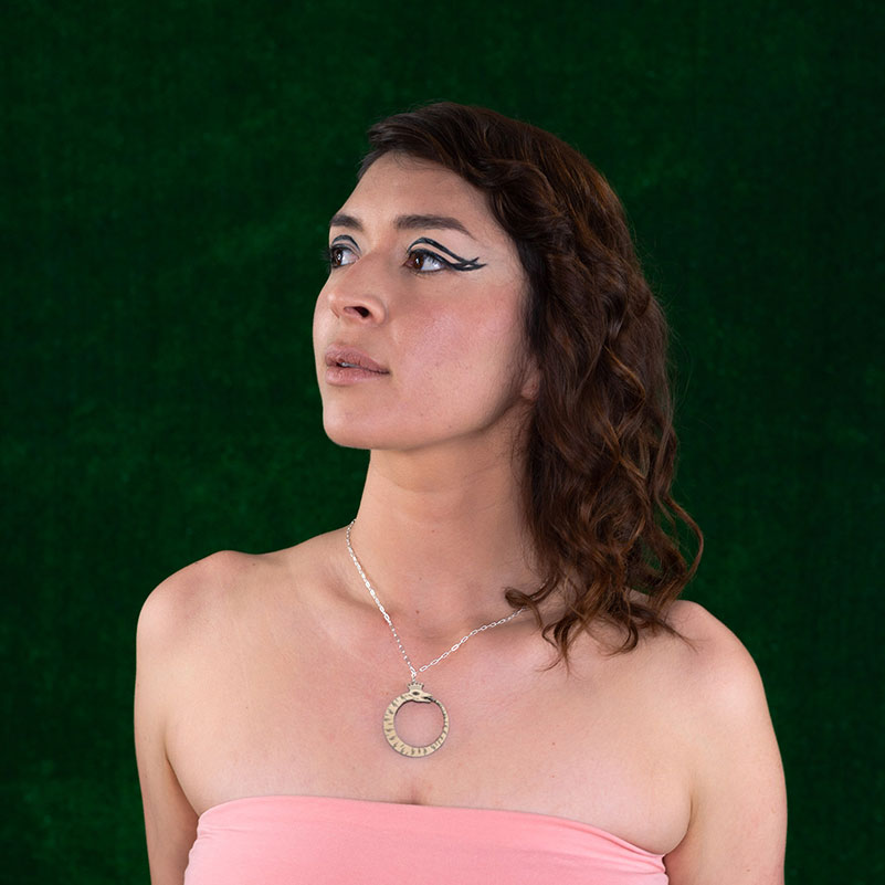 wood ouroboros necklace on model