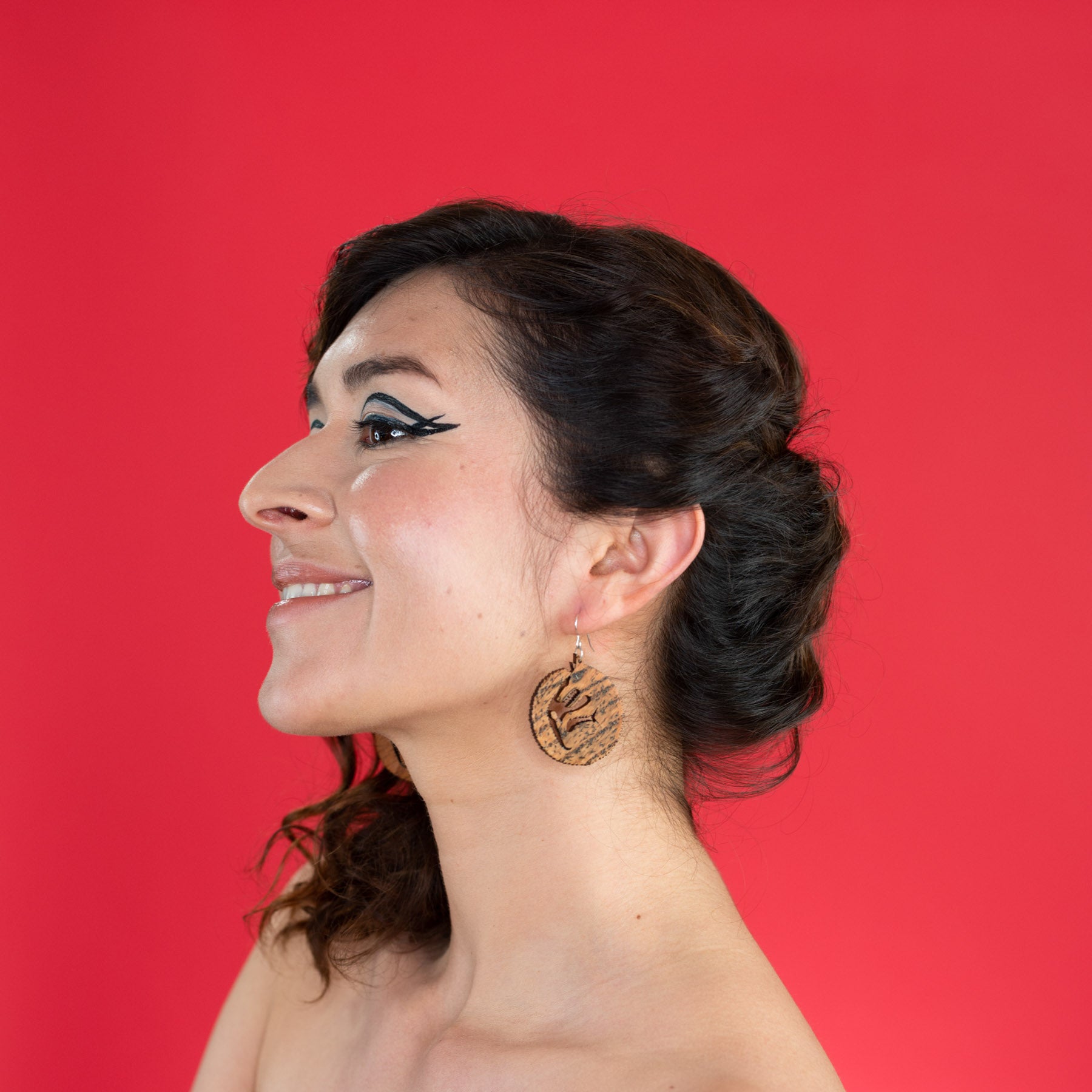 wood wolf earrings on model