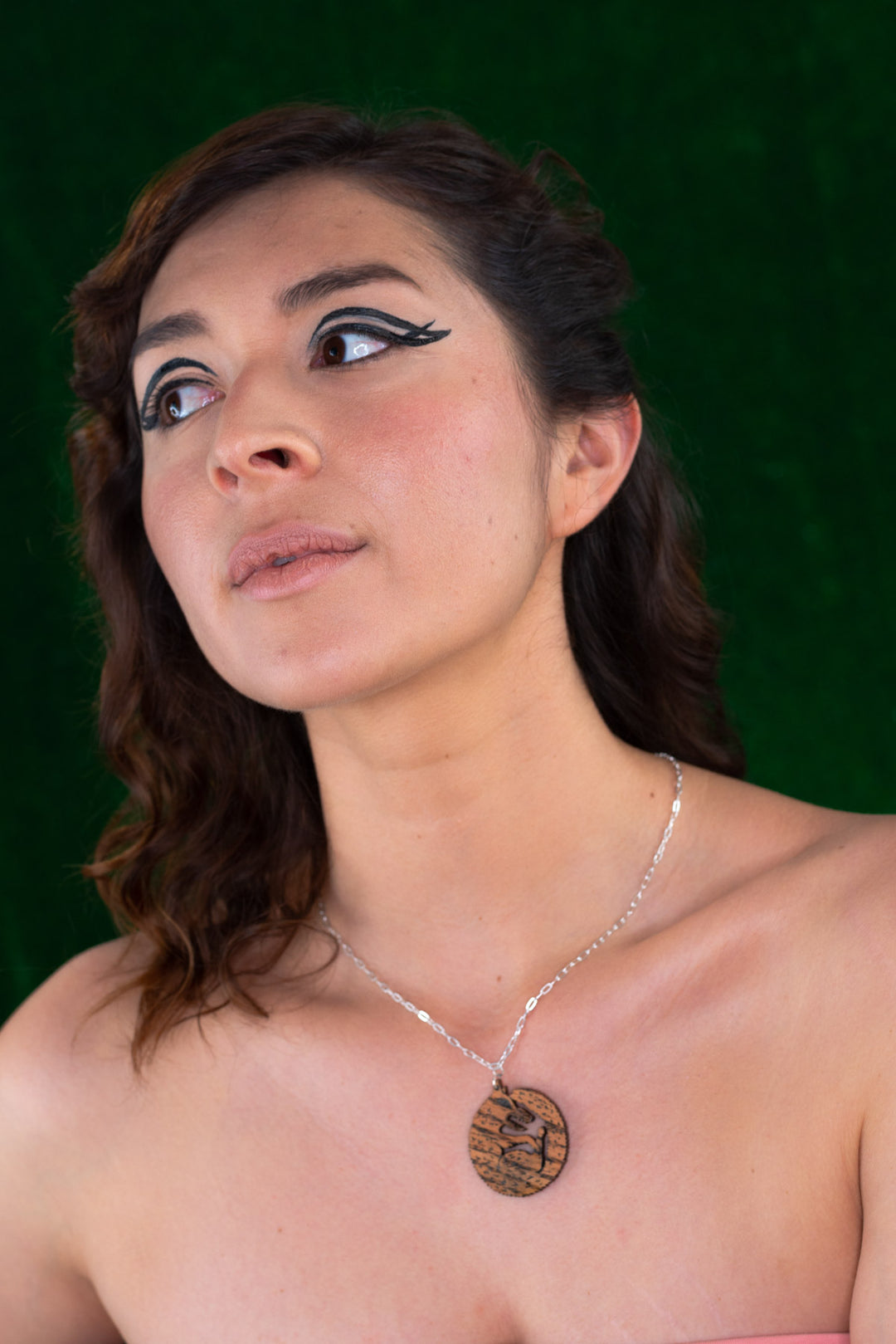 Model wearings wood wolf necklace